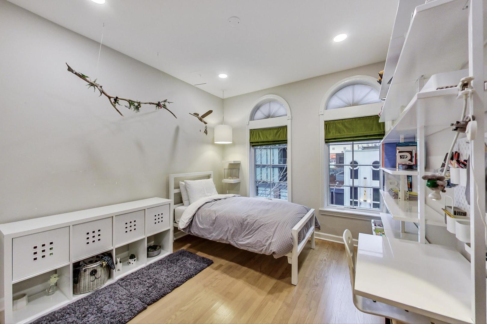 357 West Superior Street, Unit AB Chicago, IL 60654 - Photo 24 of 50 a bedroom with a bed furniture and a window