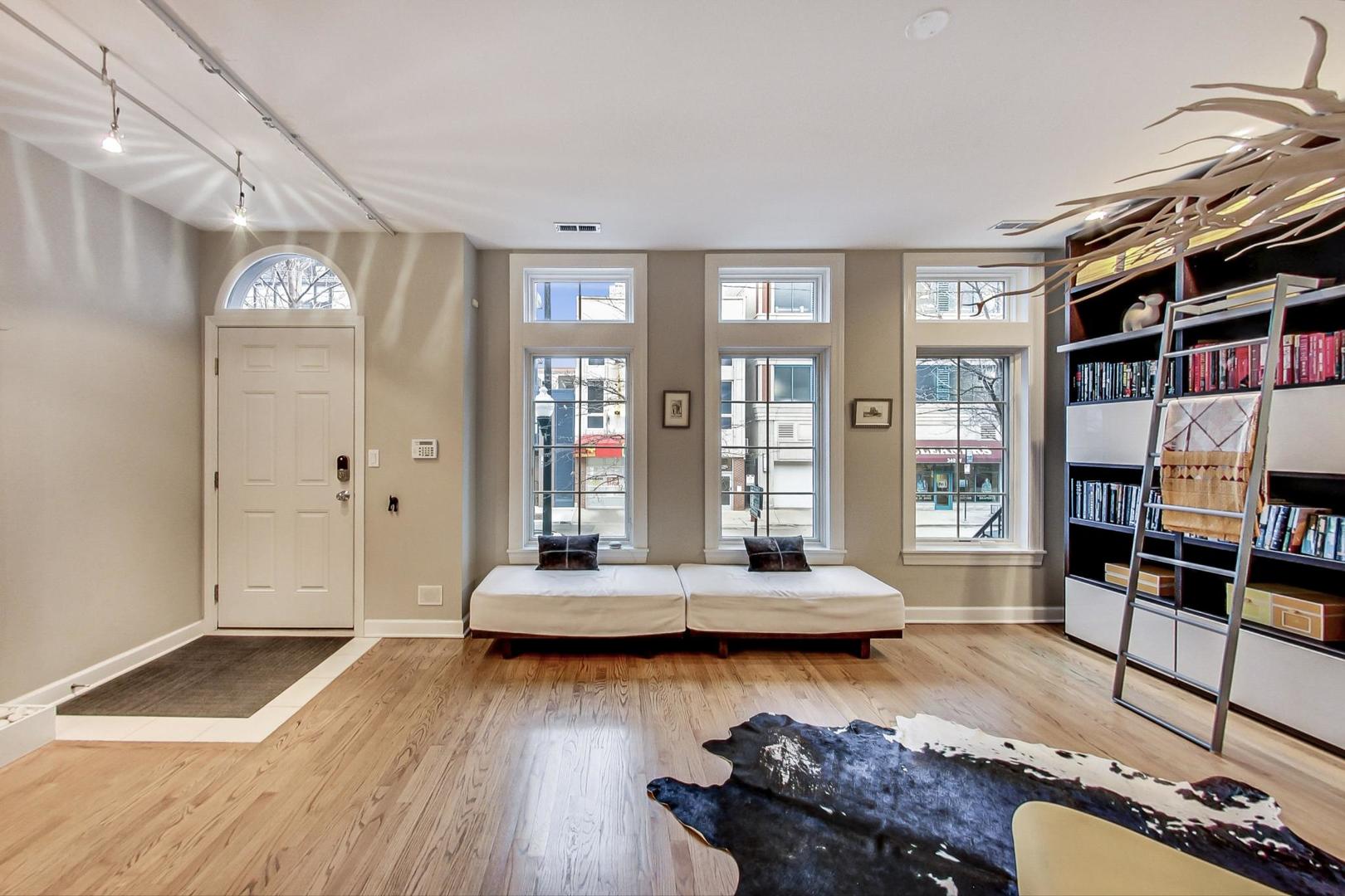 357 West Superior Street, Unit AB Chicago, IL 60654 - Photo 3 of 50 a living room with furniture and a book shelf