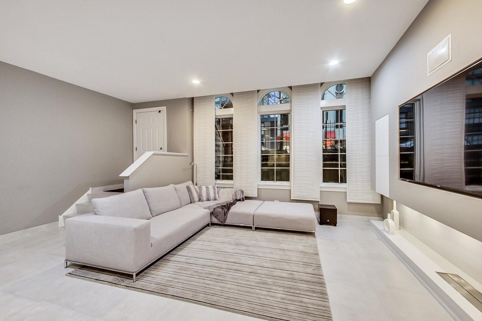 357 West Superior Street, Unit AB Chicago, IL 60654 - Photo 37 of 50 a living room with furniture window and a table