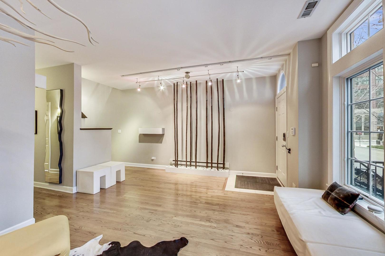 357 West Superior Street, Unit AB Chicago, IL 60654 - Photo 4 of 50 a view of a living room and hardwood floor