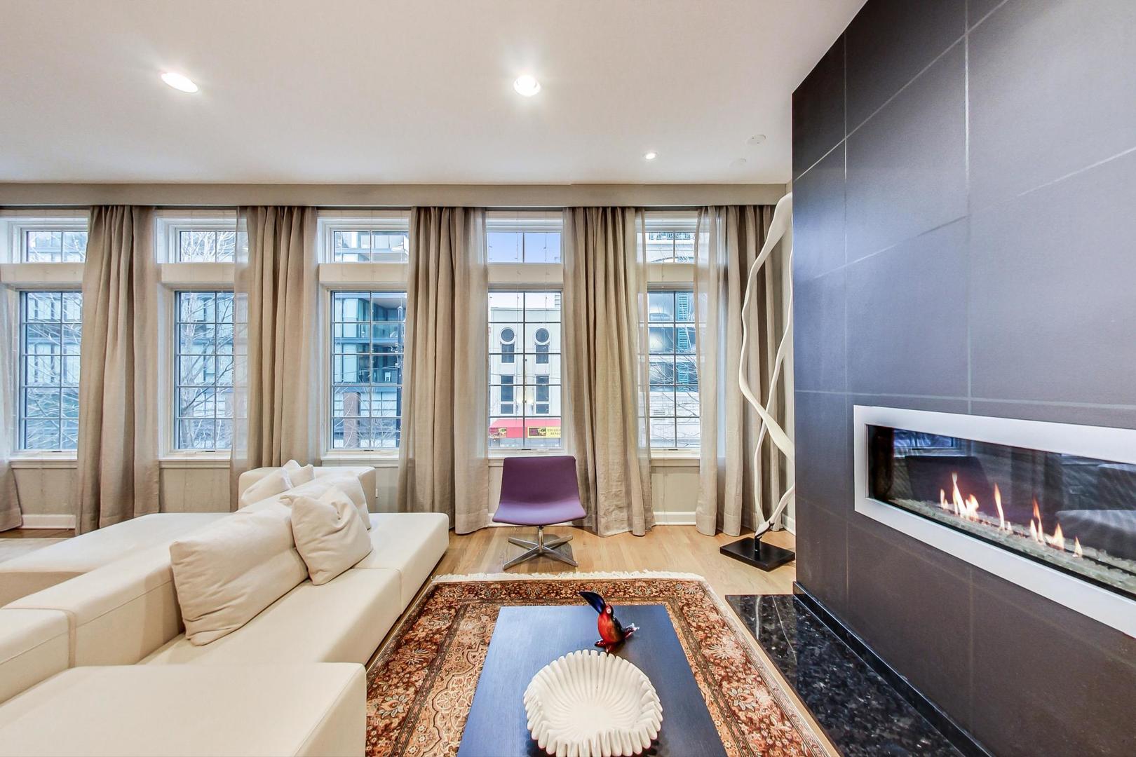 357 West Superior Street, Unit AB Chicago, IL 60654 - Photo 6 of 50 a living room with furniture and a fireplace