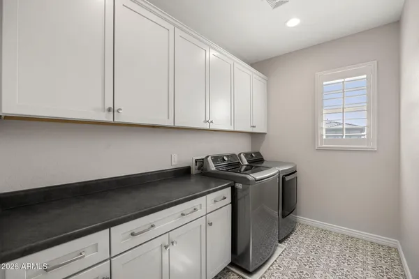 a view of a kitchen with sink and cabinets