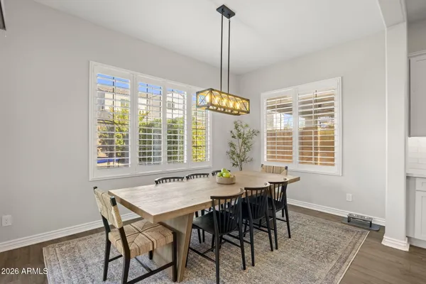 a view of a dining room with furniture window and wooden floor