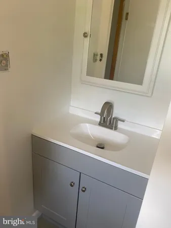 a close view of a sink and a mirror
