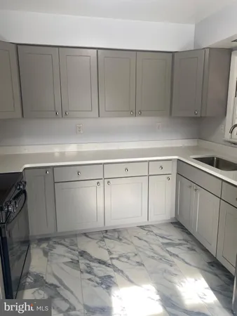 a view of a kitchen with cabinets