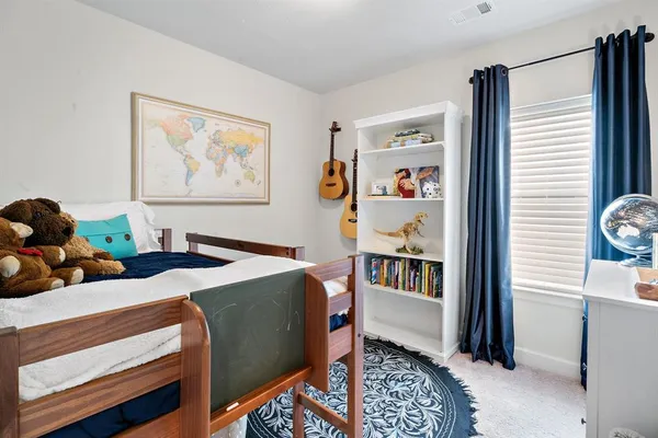 a bed room with furniture and a window