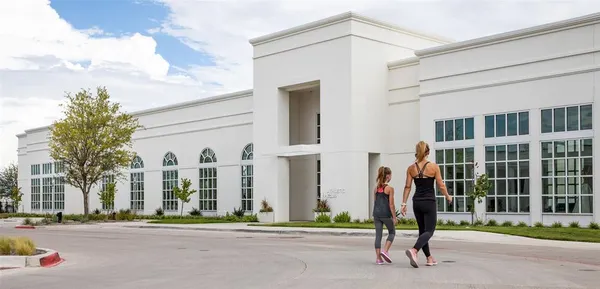 a view of a brick building next to a yard