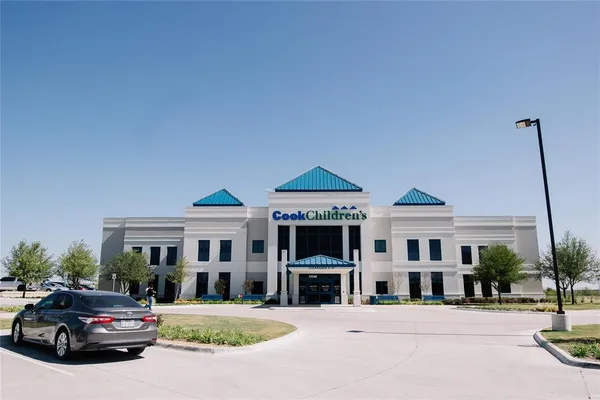 a front view of a building with street view