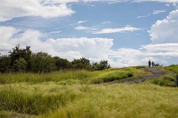 a view of a lake view with houses in back