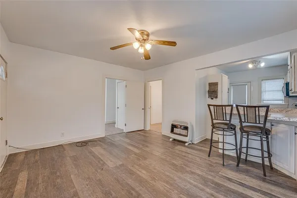 a view of a livingroom with furniture and wooden floor