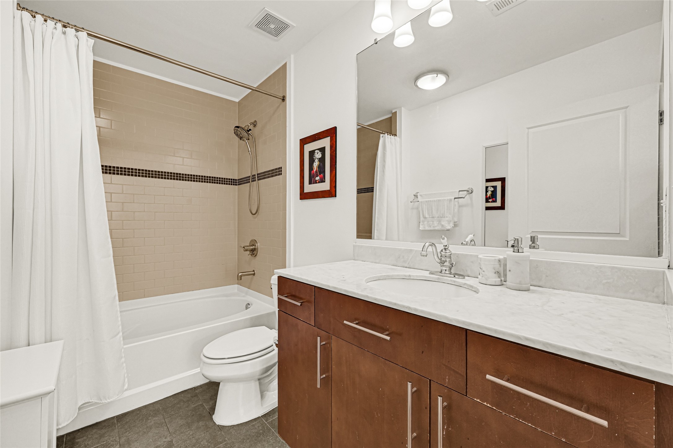 5925 Almeda Road, Unit 10908 Houston, TX 77004 - Photo 15 of 37 a bathroom with a granite countertop sink toilet and shower