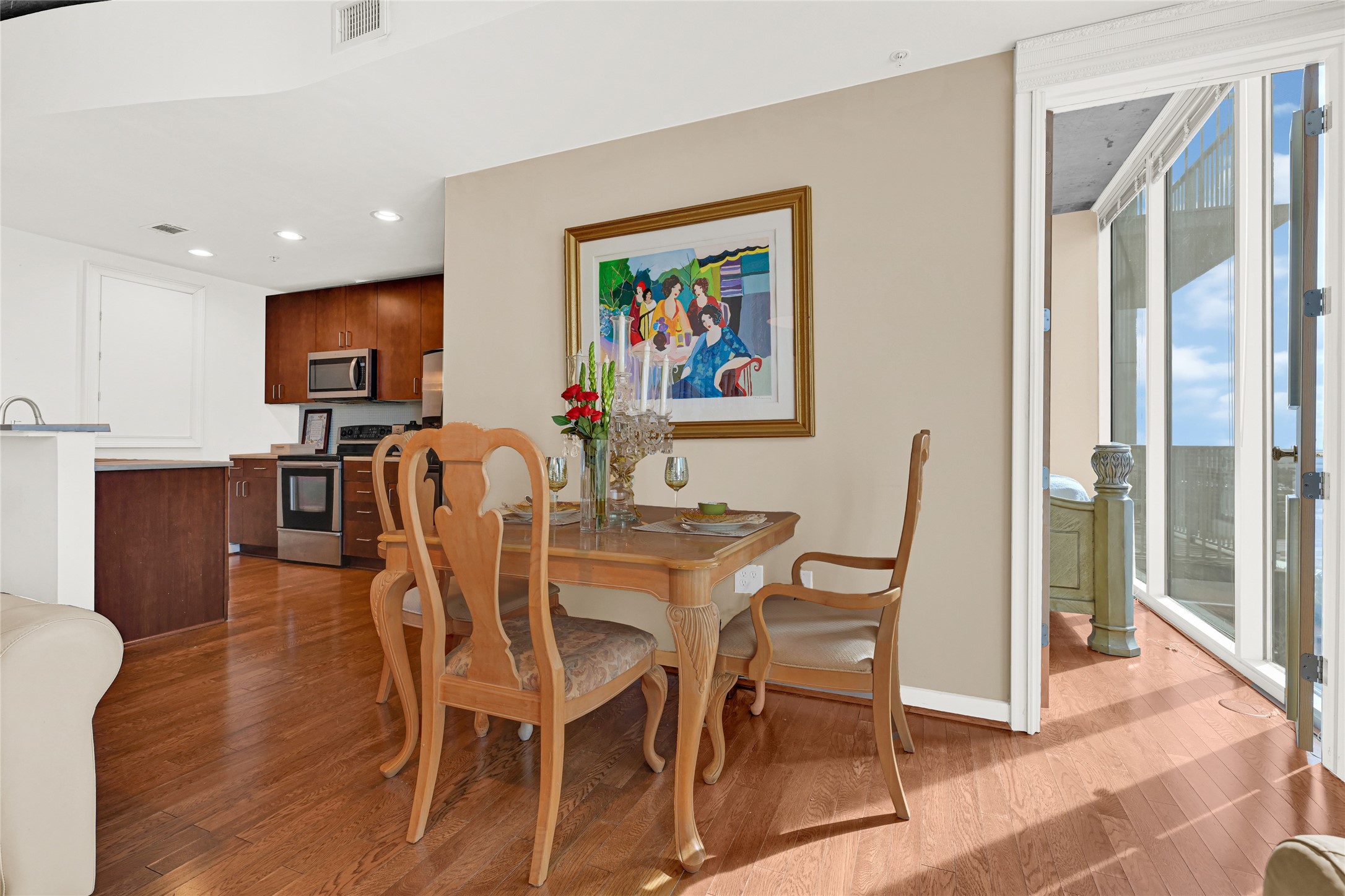 5925 Almeda Road, Unit 10908 Houston, TX 77004 - Photo 7 of 37 a view of a dining room with furniture and wooden floor