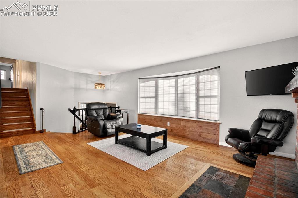 5226 Rocking R Drive Colorado Springs, CO 80915 - Photo 11 of 46 a living room with furniture and a flat screen tv