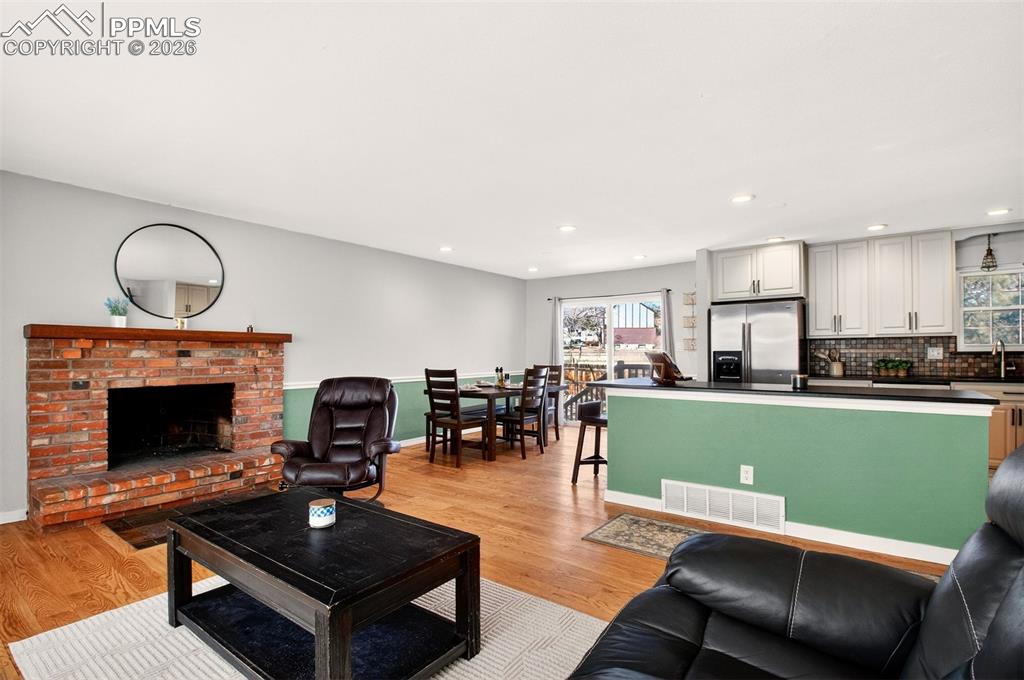 5226 Rocking R Drive Colorado Springs, CO 80915 - Photo 12 of 46 a living room with furniture and a fireplace