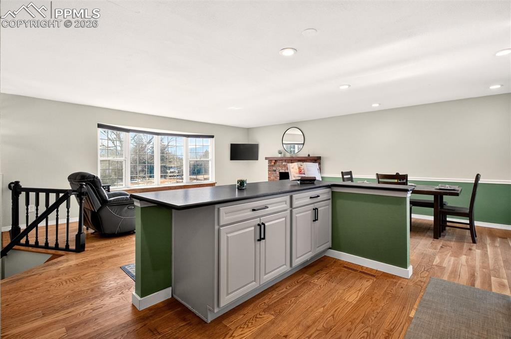 5226 Rocking R Drive Colorado Springs, CO 80915 - Photo 16 of 46 a kitchen with cabinets table and chairs