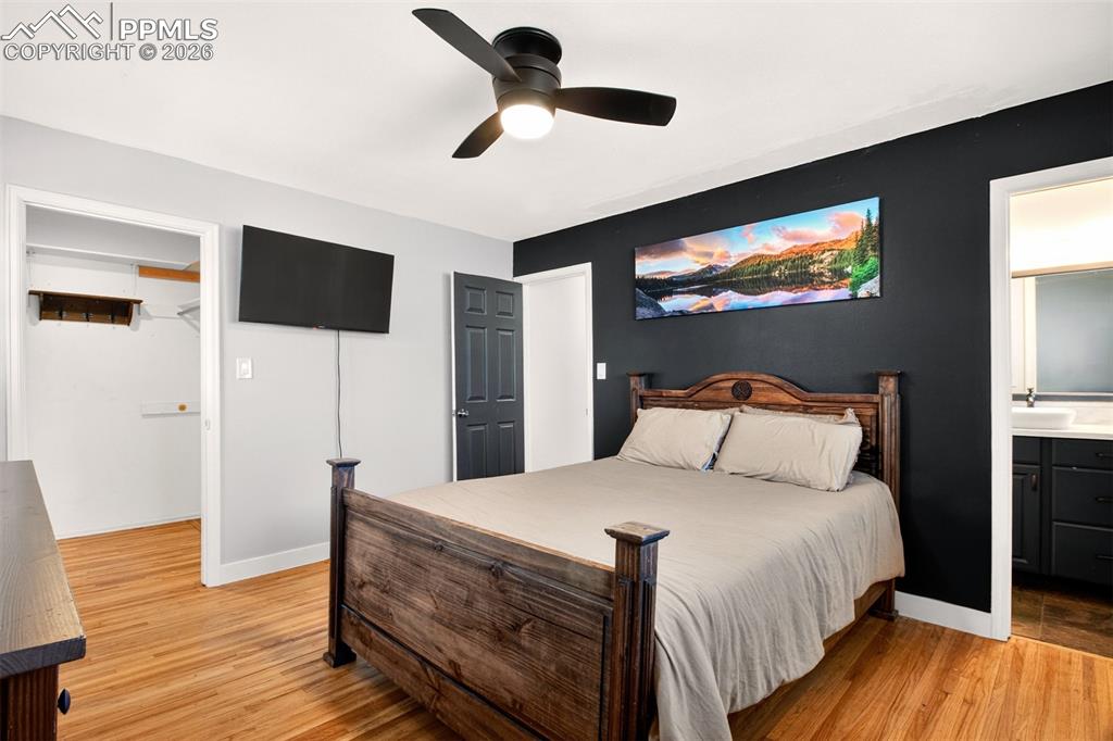 5226 Rocking R Drive Colorado Springs, CO 80915 - Photo 21 of 46 a bedroom with a bed and a flat screen tv