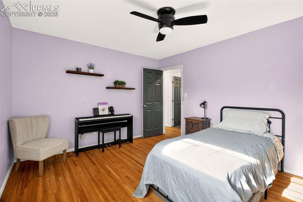 5226 Rocking R Drive Colorado Springs, CO 80915 - Photo 24 of 46 a bedroom with a bed and a chair