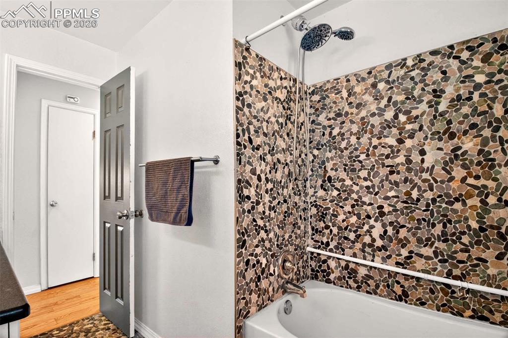 5226 Rocking R Drive Colorado Springs, CO 80915 - Photo 26 of 46 a bathroom with a shower curtain