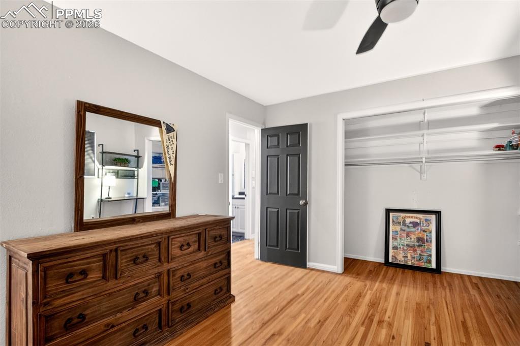 5226 Rocking R Drive Colorado Springs, CO 80915 - Photo 28 of 46 a view of room with window and wooden floor