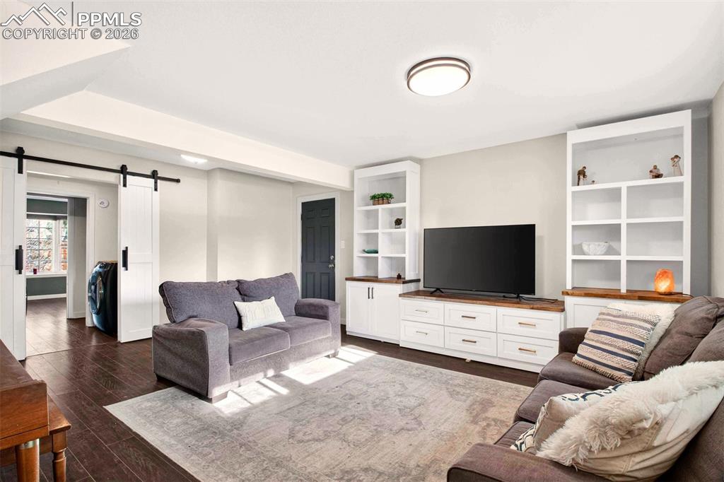 5226 Rocking R Drive Colorado Springs, CO 80915 - Photo 31 of 46 a living room with furniture and a flat screen tv