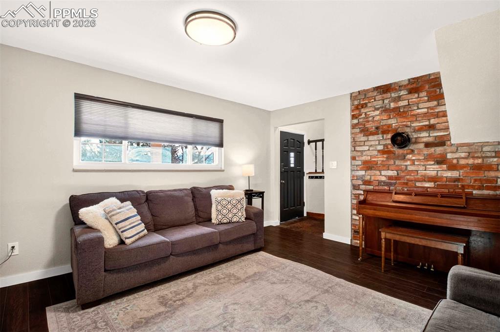 5226 Rocking R Drive Colorado Springs, CO 80915 - Photo 33 of 46 a living room with furniture and a fireplace