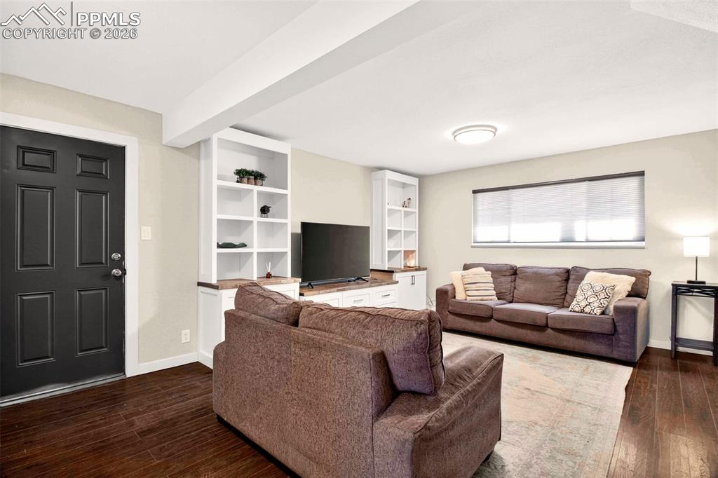 5226 Rocking R Drive Colorado Springs, CO 80915 - Photo 34 of 46 a living room with furniture and a flat screen tv