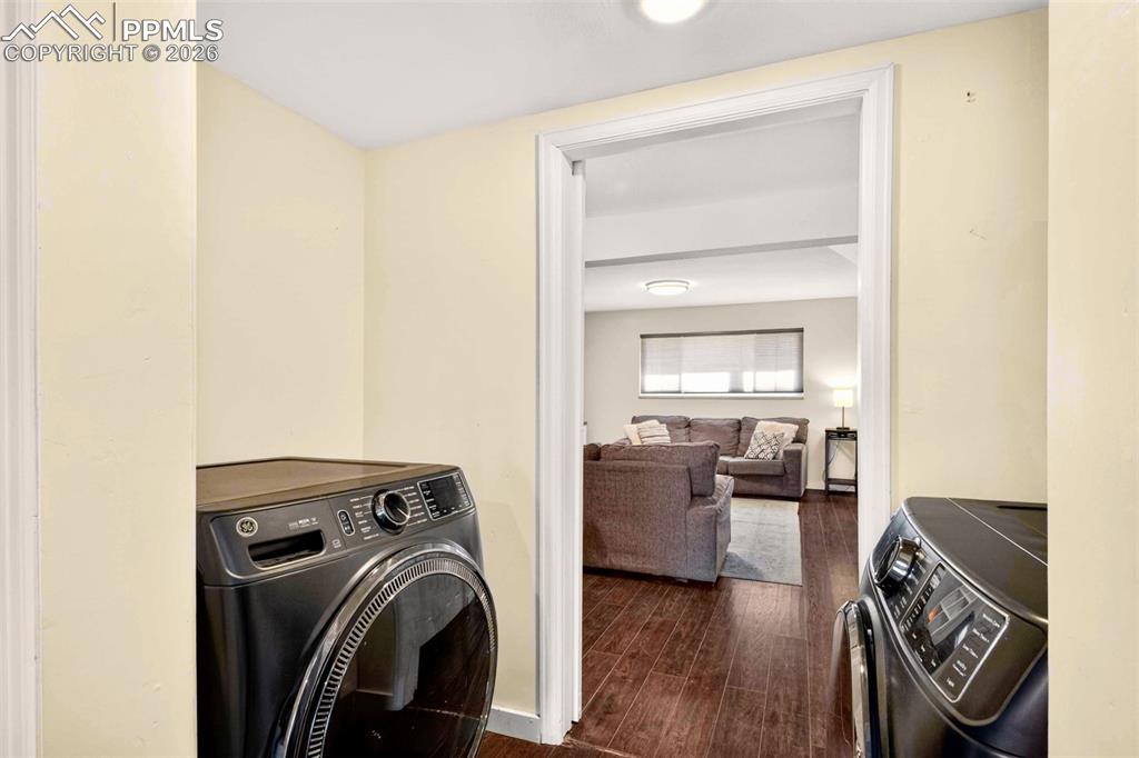5226 Rocking R Drive Colorado Springs, CO 80915 - Photo 35 of 46 a view of a livingroom with furniture wooden floor and windows