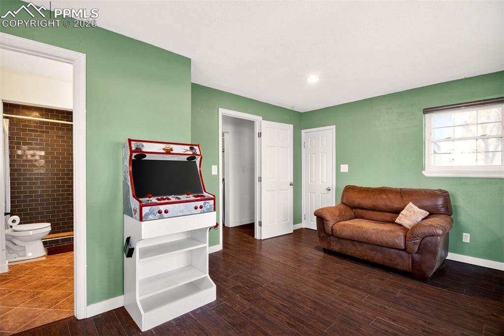 5226 Rocking R Drive Colorado Springs, CO 80915 - Photo 38 of 46 a living room with furniture and a flat screen tv