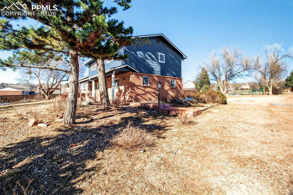 5226 Rocking R Drive Colorado Springs, CO 80915 - Photo 4 of 46 a front view of a house with a yard