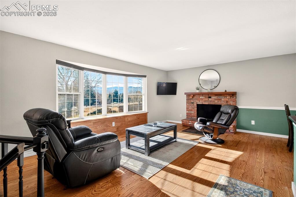 5226 Rocking R Drive Colorado Springs, CO 80915 - Photo 8 of 46 a living room with furniture and a fireplace