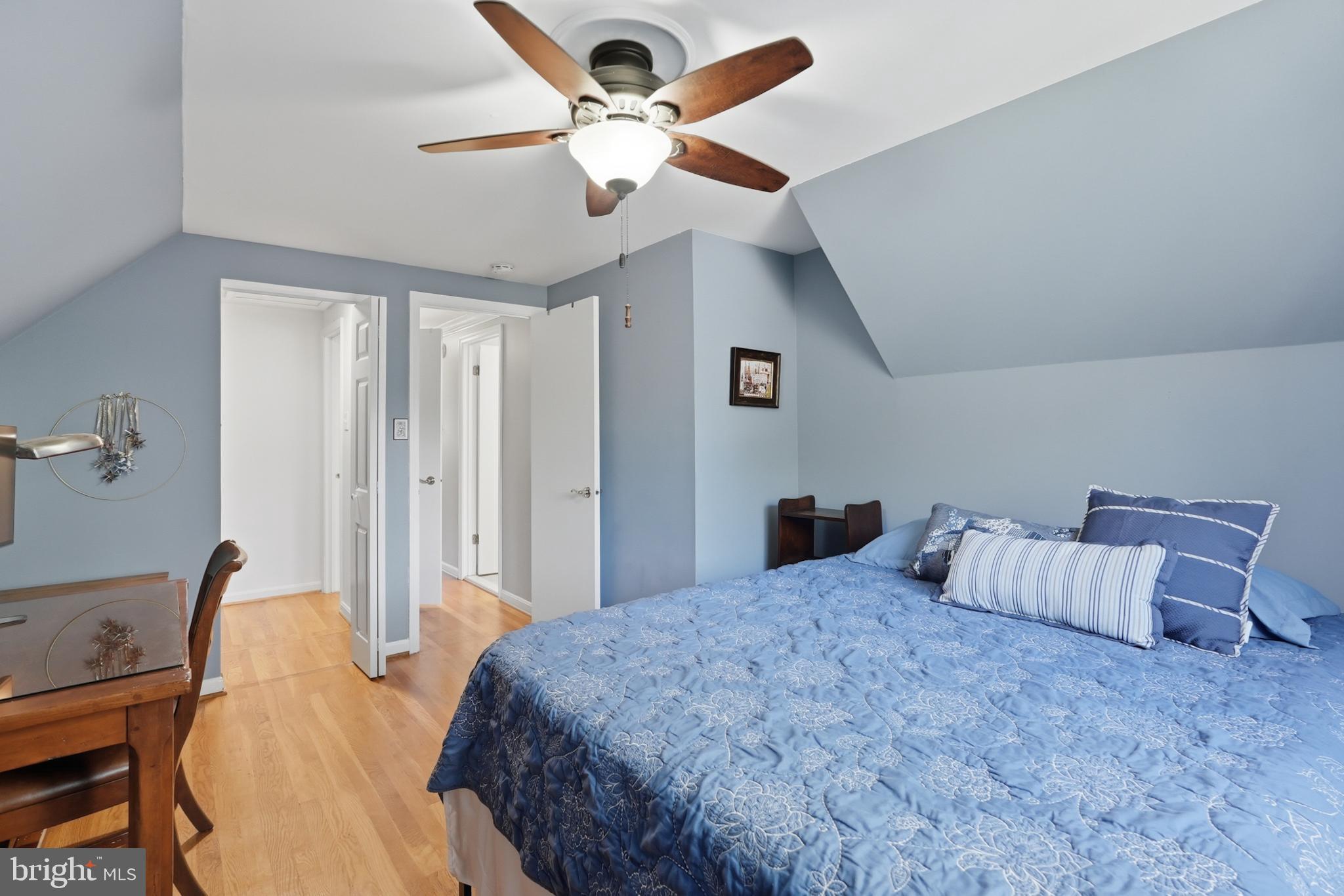 7006 Barnack Drive Springfield, VA 22152 - Photo 30 of 56 a bedroom with a bed and a chandelier