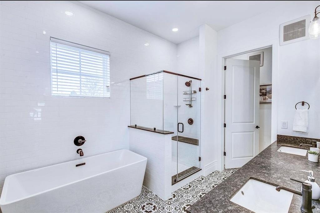 12001 Inwood Road, Unit 3701 Dallas, TX 75244 - Photo 10 of 15 Bathroom featuring tile walls, separate shower and tub, tile floors, and dual bowl vanity