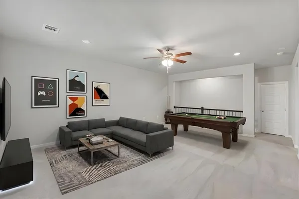 a living room with furniture and a rug