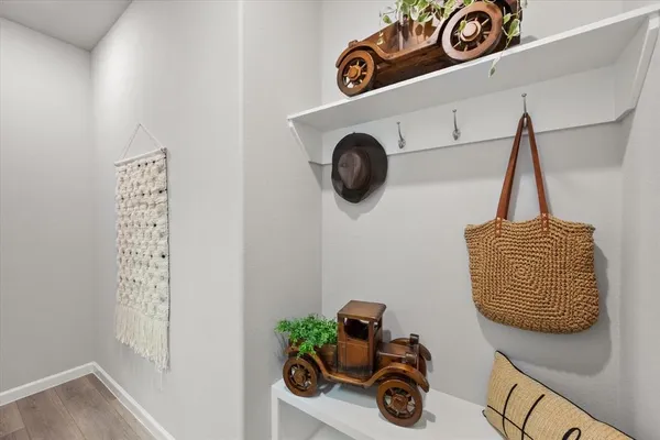 a view of storage and utility room with two washing machine