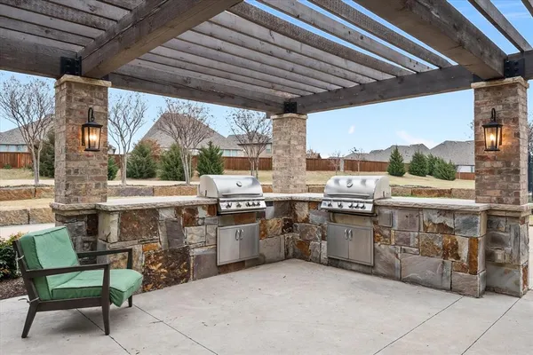 a open kitchen with stainless steel appliances granite countertop a stove and a sink
