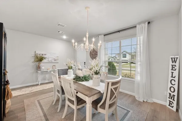 a view of a dining room with furniture window and outside view
