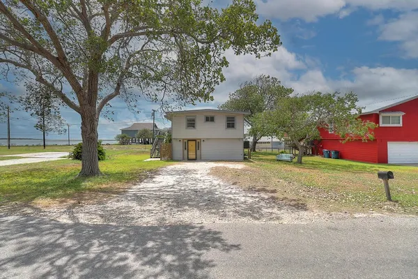 a house with garden in front of it