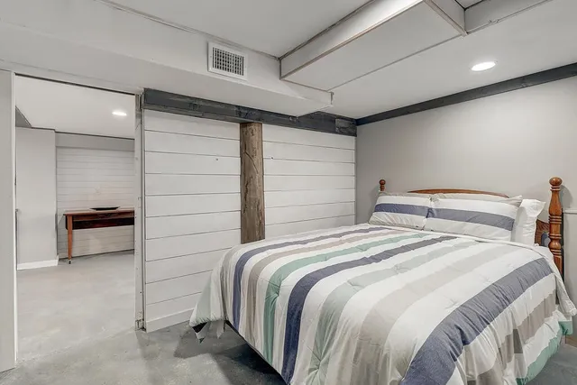 a bedroom with a bed and a cabinets