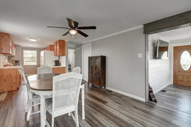 a dining room with furniture and window