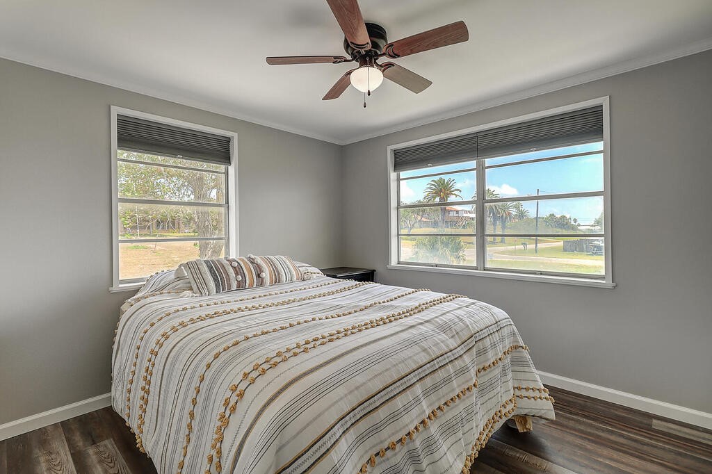 810 North Sandpiper Ingleside, TX 78362 - Photo 29 of 40 a bedroom with a bed and a window