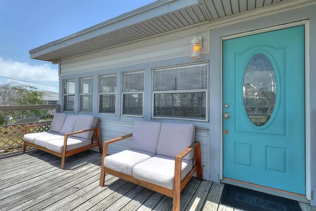 a view of a two chairs in the balcony