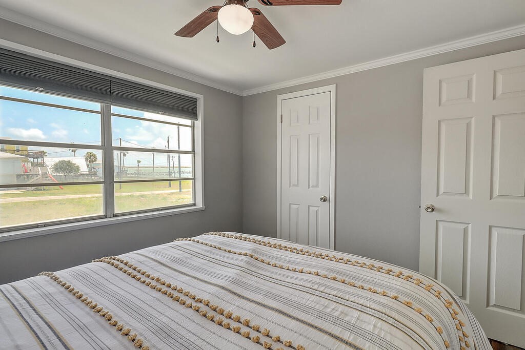 810 North Sandpiper Ingleside, TX 78362 - Photo 31 of 40 a bedroom with a bed and a window