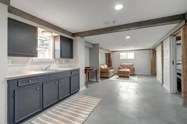 a spacious bathroom with a double vanity sink and a large mirror