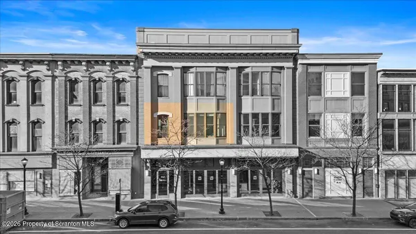 a view of a building on a street