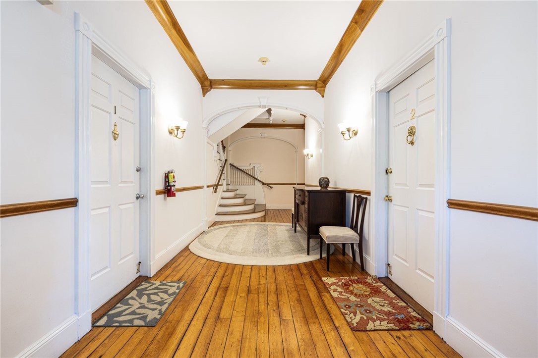 20 Berkeley Avenue, Unit 2 Newport, RI 02840 - Photo 8 of 46 Beautiful hallway, accesses lower level and stairs to all 7 units.