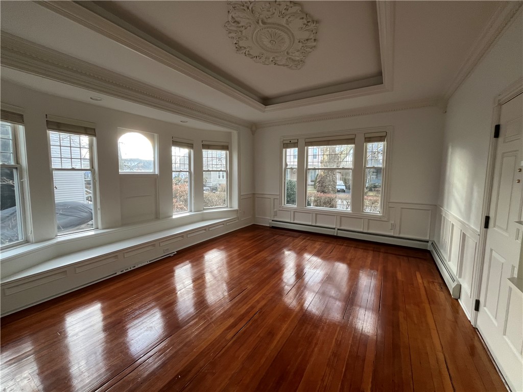 20 Berkeley Avenue, Unit 2 Newport, RI 02840 - Photo 10 of 44 This living room is 19'5" x 17'1". All interiors have been freshly painted white, including walls, ceiling, detailed trim! Older photos show colored walls. Lovely window seat too!