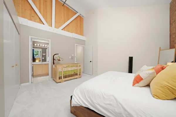 a bedroom with a bed and a dresser