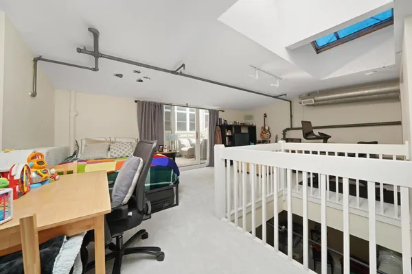 a bedroom with bed and a window