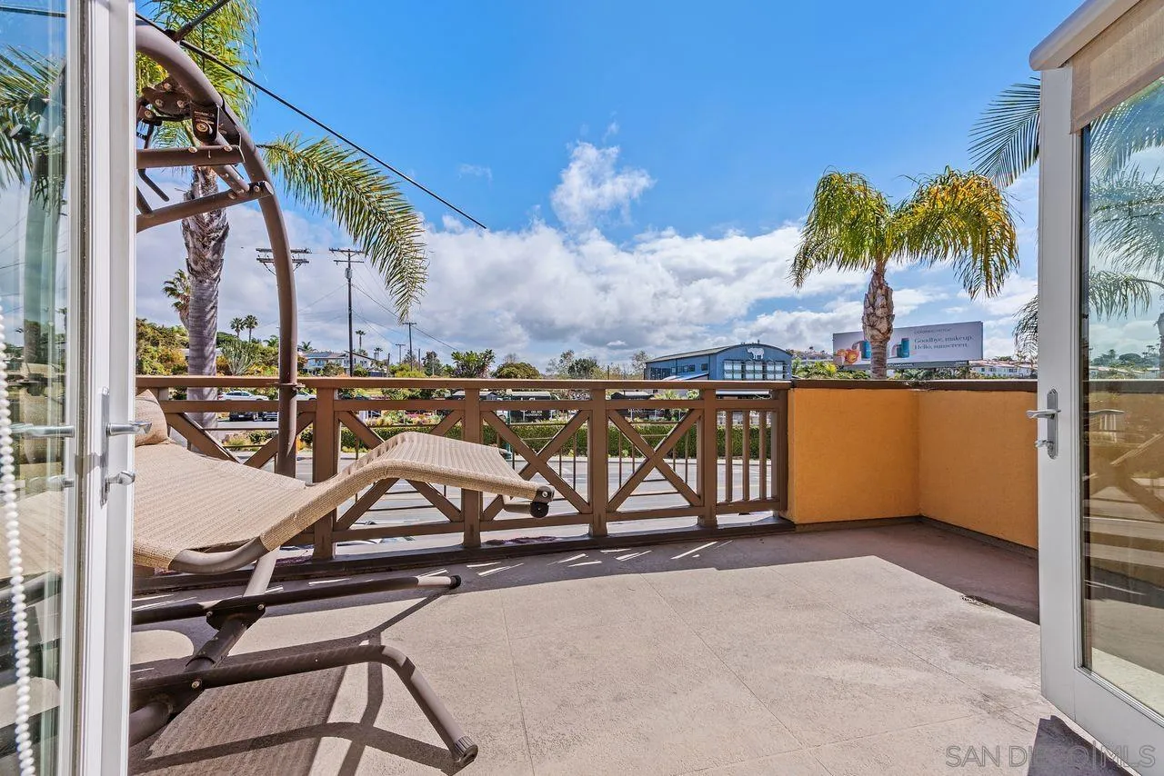 90 North Coast Highway 101 Encinitas, CA 92024 - Photo 11 of 39 a view of a swimming pool with a table and chairs