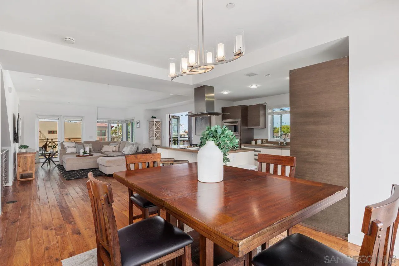 90 North Coast Highway 101 Encinitas, CA 92024 - Photo 14 of 39 a view of a dining room with furniture and wooden floor